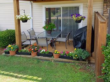 beautiful private patio with flowers and furnishings